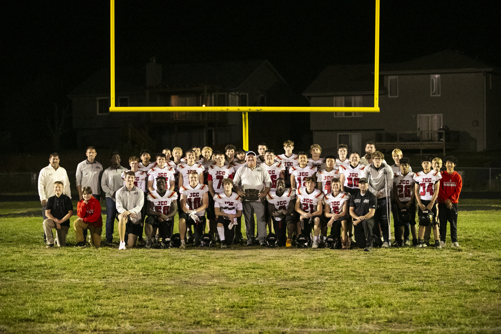 JCC Football Team after Coach Ryan Haughton's 100th Career Win vs OCA