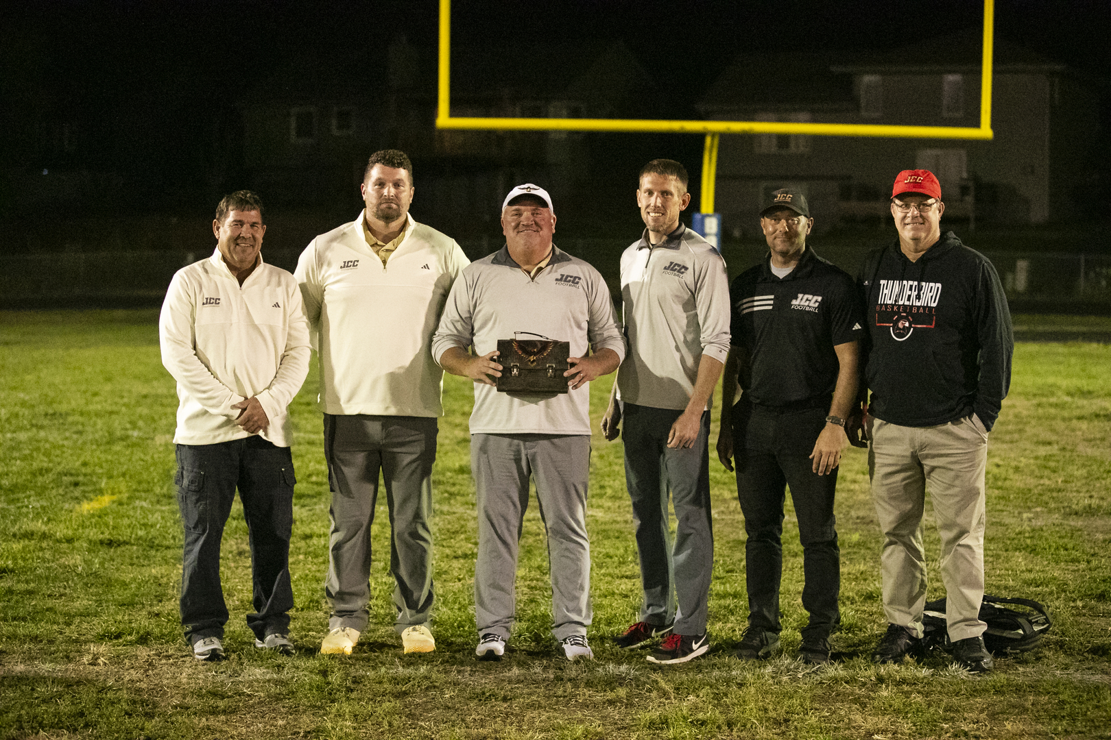 JCC Football Coaches with Head Coach Haughton after his 100th Career Win