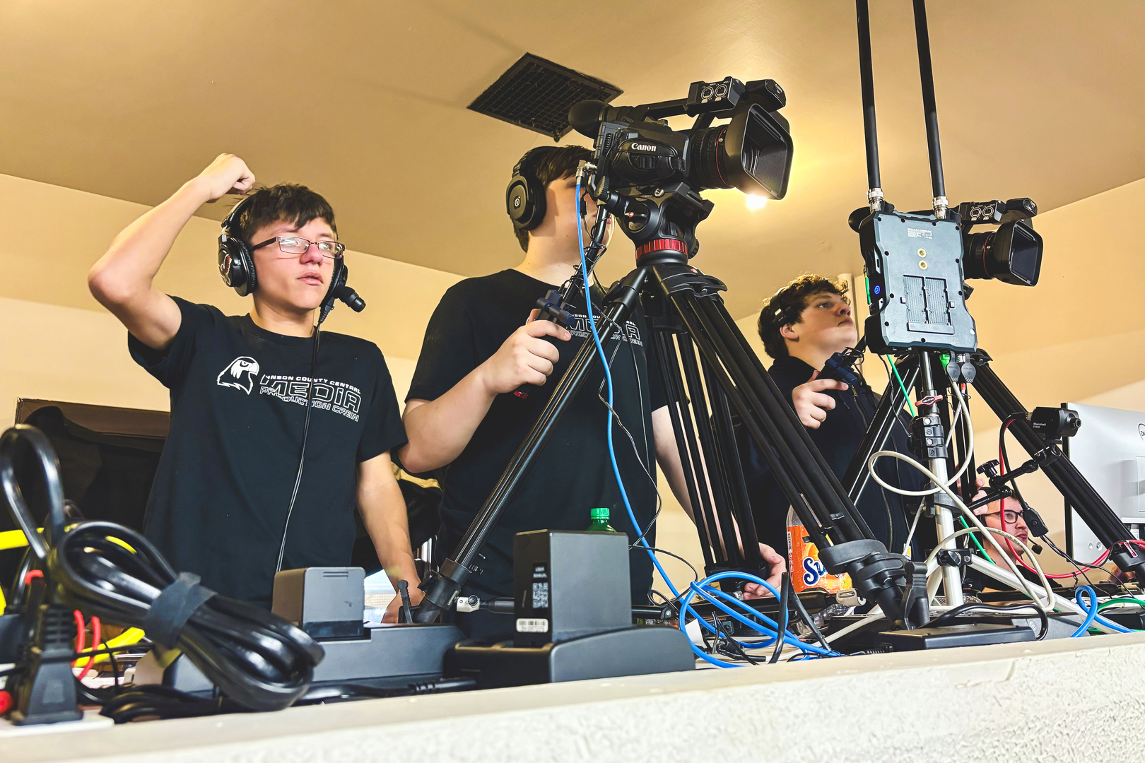 JCC Striv shown working on the commentating headset and operating cameras at the 2026 MUDECAS Basketball Tournament