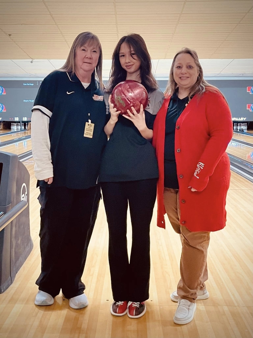 JCC senior Salena Conley (middle) pictured with Assistant Coach Candy Laue (left) and Head Coach Lisa Schuster (right)