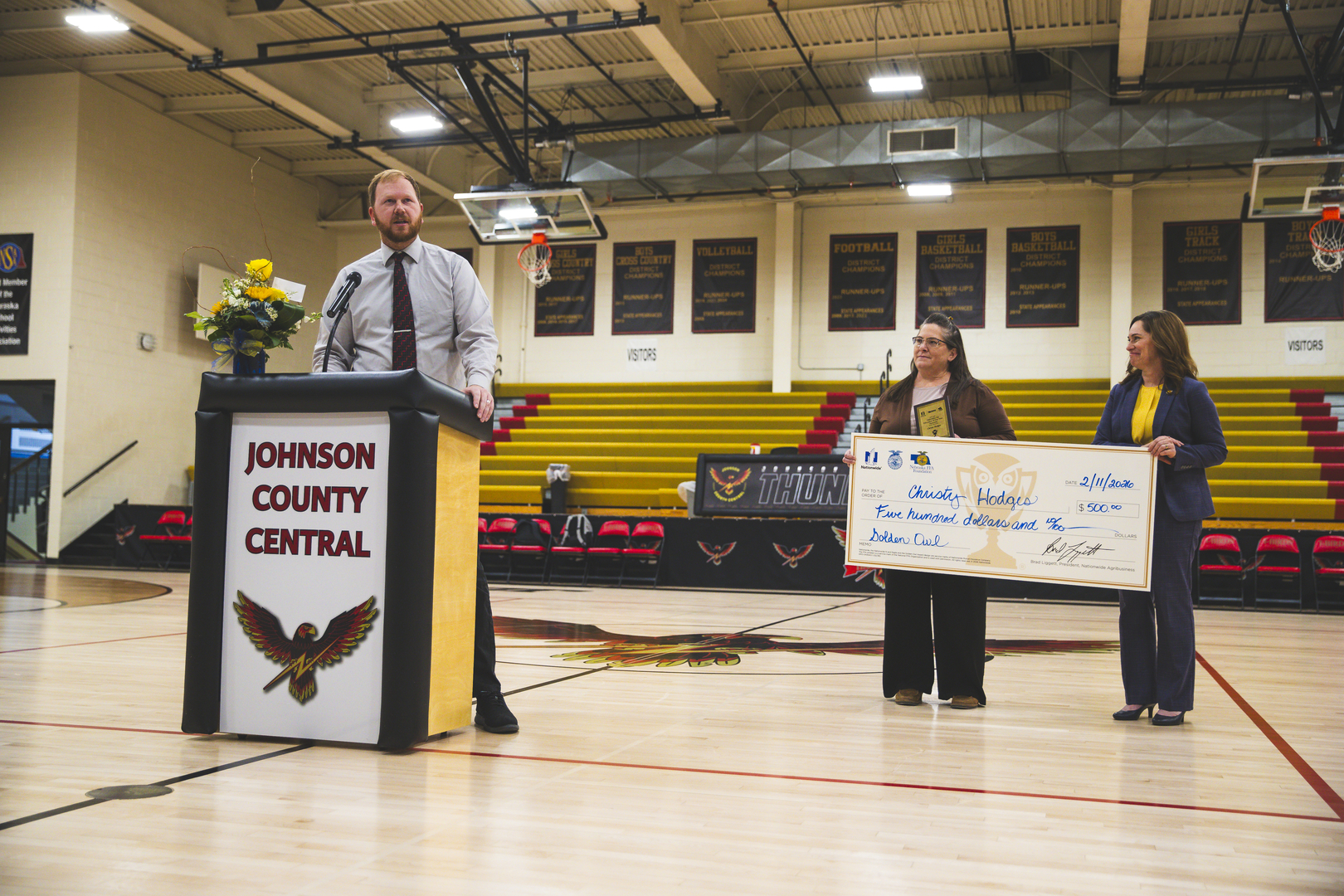 HS Principal Mr. Damme announcing Mrs. Hodges as a Golden Owl Finalist