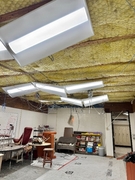 Lower level classroom with exposed ceiling.