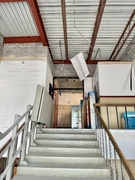 North stairs leading to second floor.
